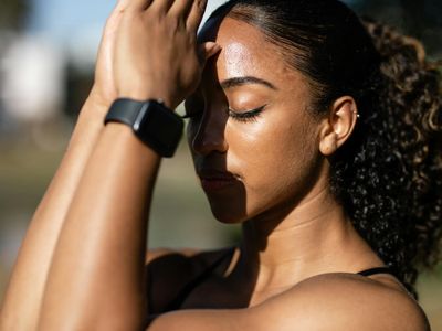 A calm person breathing deeply with closed eyes.